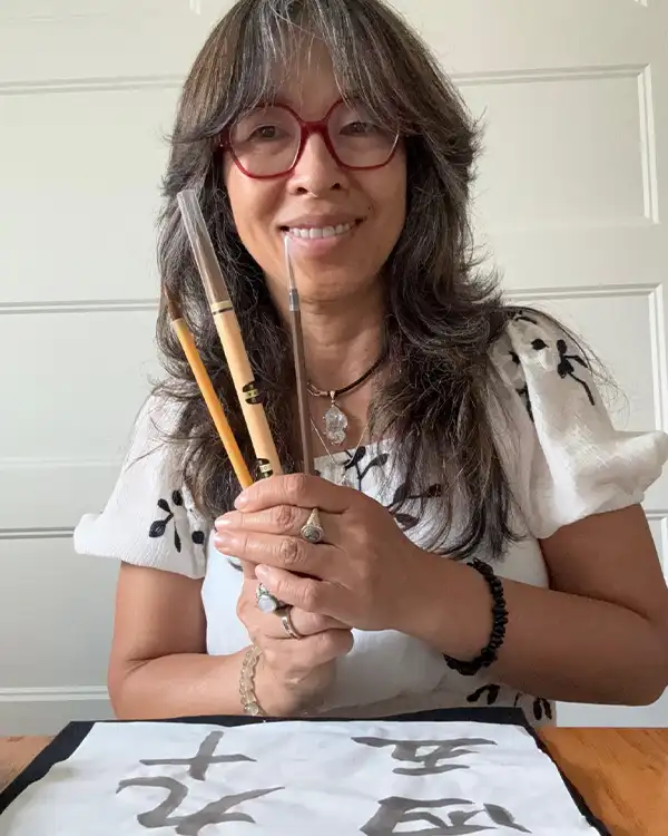Traditional Japanese calligraphy with brush and ink